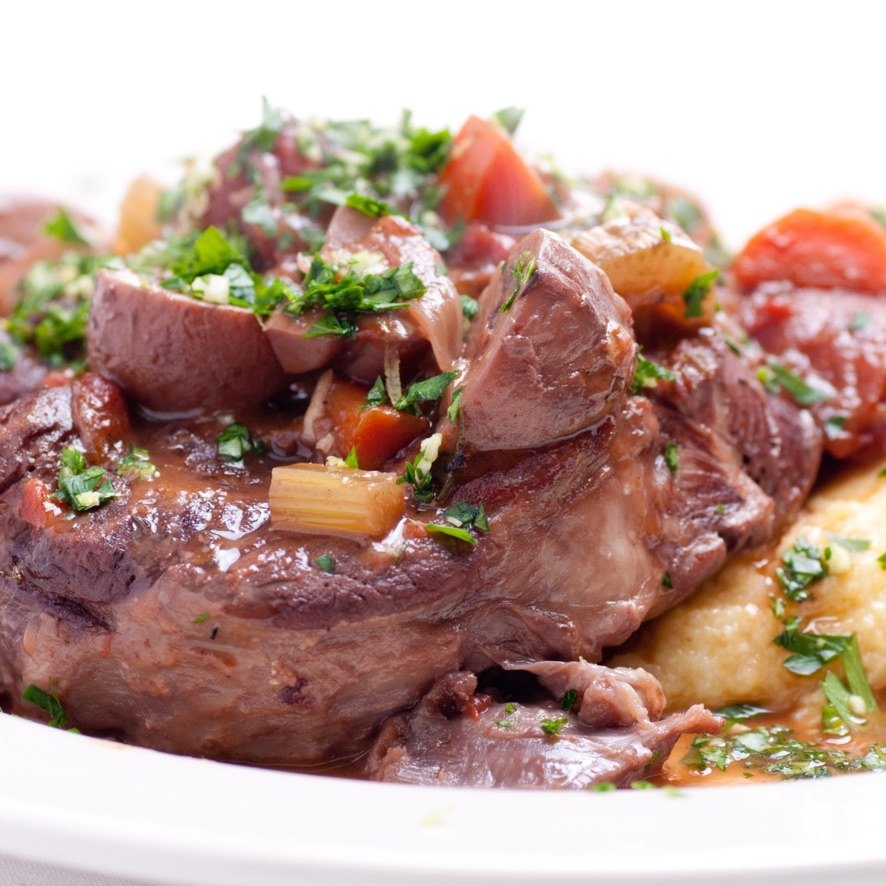 Braised shank plated with gremolata