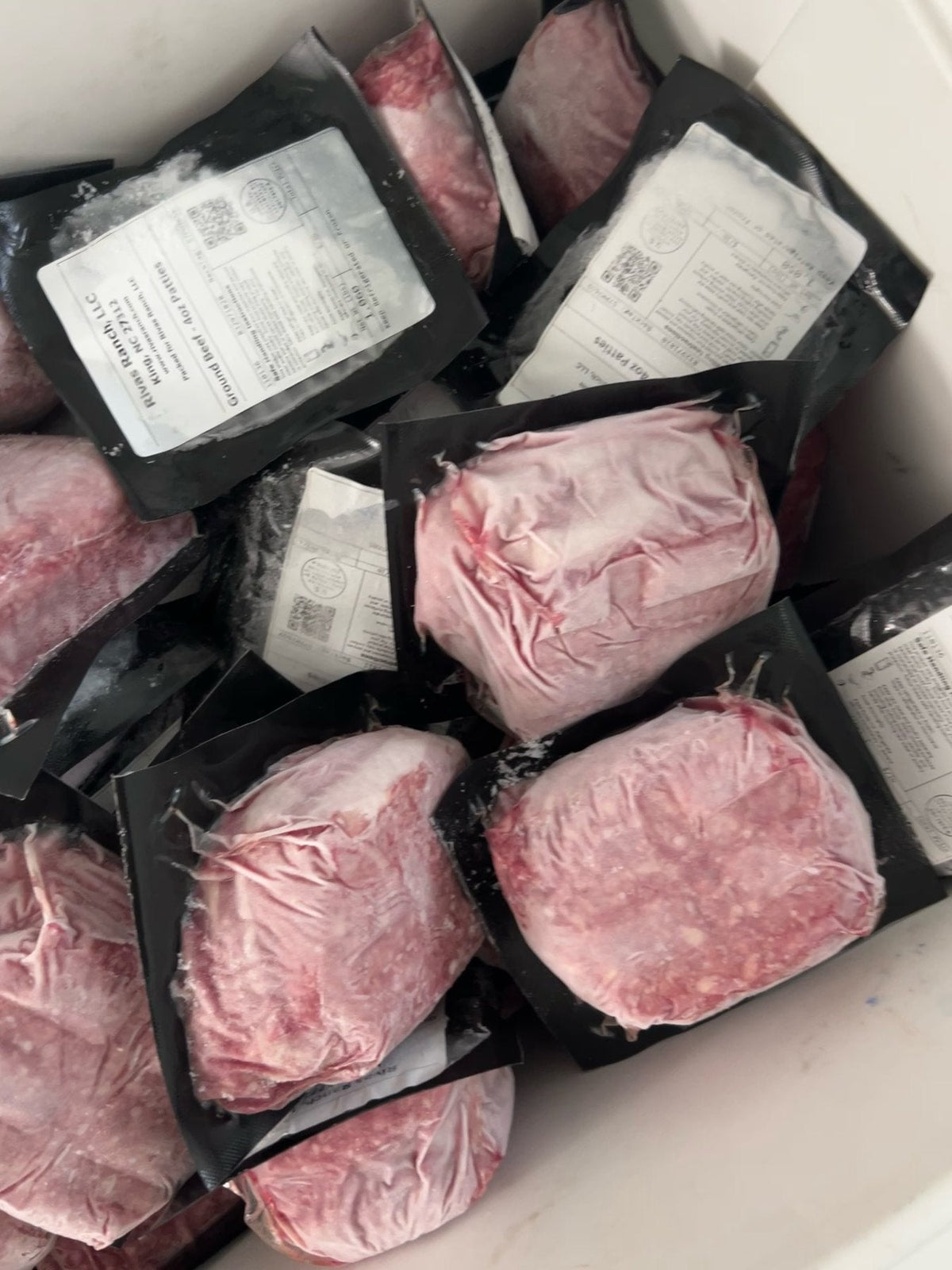 Cooler of labeled Rivas Ranch ground meat packs