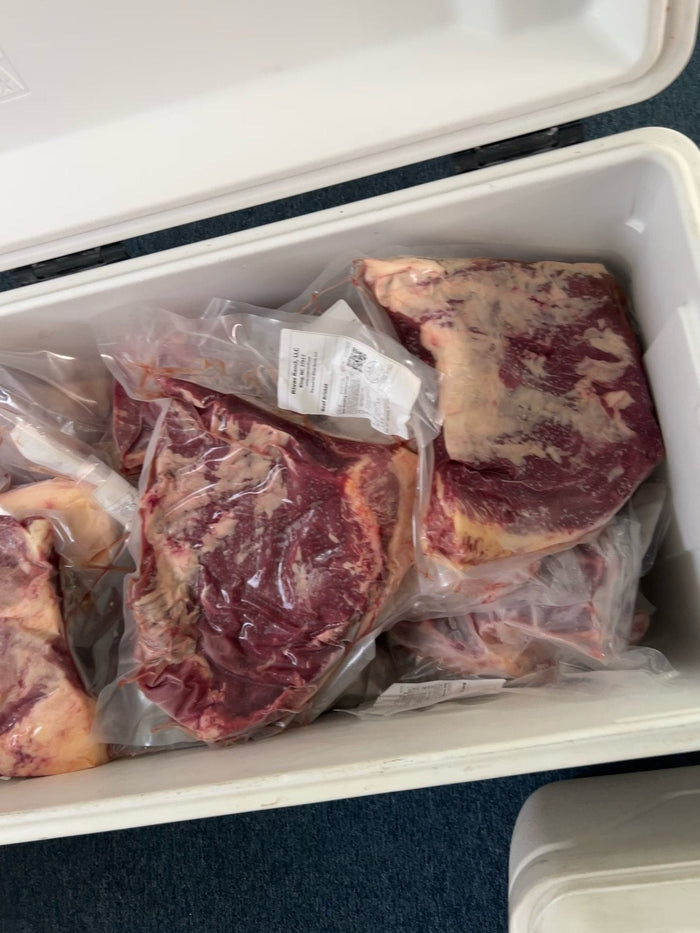 Cooler of vacuum-packed Rivas Ranch steaks